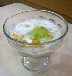 Es teler, an Indonesian dessert made from shaved ice, condensed milk, coconut, avocado, and jackfruit.
