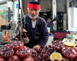 The Pomegranate Man While walking through the Shuk Hacarmel